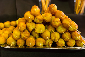 Pile of Deep Fried Skewers on Metal Tray