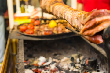 Shawarma Meat Roasting on Spit Over Hot Coals