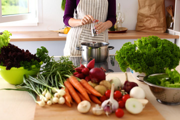 A young girl in kitchen while cooking