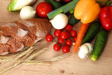 Composition with assorted raw organic vegetables wooden table