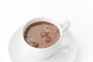 a cup of chocolate on white