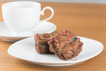 brownies in plate on wood table