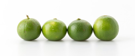 green lemon isolated on white background