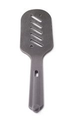 Used black plastic spatula isolated