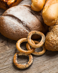 assortment of baked bread on wood table
