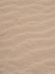 Fototapeta na wymiar Wellenmuster im Sand als Hintergrund