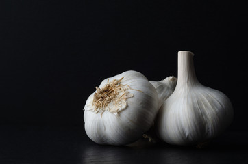 Garlic Bulbs on Black Slate