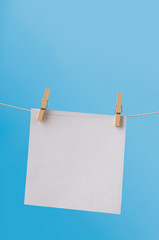 Single Note Paper on Washing Line against Blue Sky
