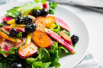 Summer salad with vegetables and berries