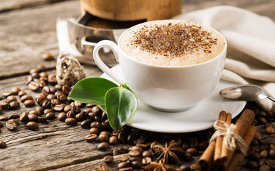 Hot coffee and pastries on a wooden background