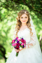 Young Happy Bride With Flower Bouquet on swing