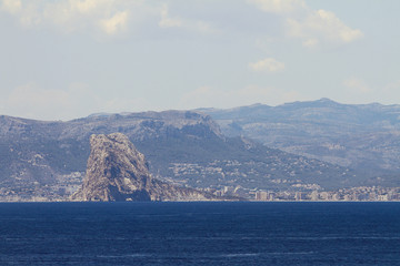 Rock and city on Mediterranean coast. Calp, Spain