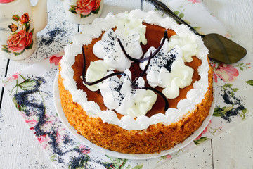 Honey cake with whipped cream and caramel.