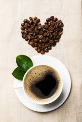 Heart of coffee beans on sacking, view from the top