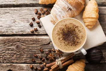 Papier Peint photo Bar a café Hot coffee and pastries on a wooden background