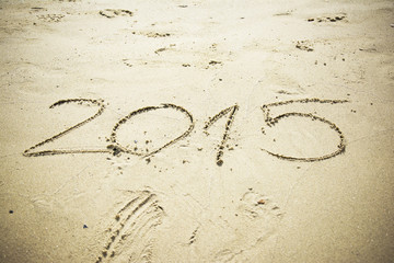 Number 2015 written in sand