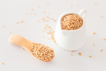 Yellow flax seed on clean kitchen table