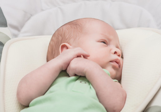 The newborn one-month baby lies