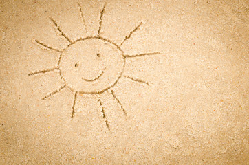 sun drawing on sand