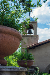 Terra cotta pot with chapel steeple in background
