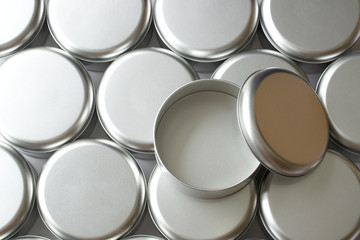 Many round tin boxes from top view