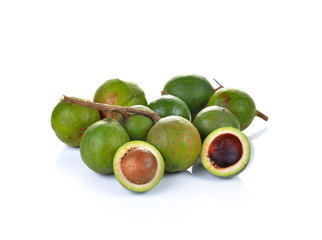 Fresh macadamia nuts on white background