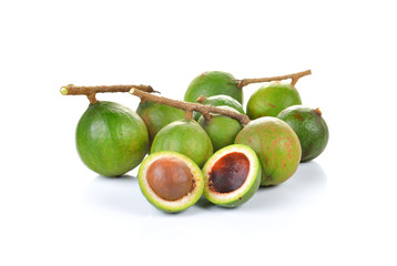 Fresh macadamia nuts on white background