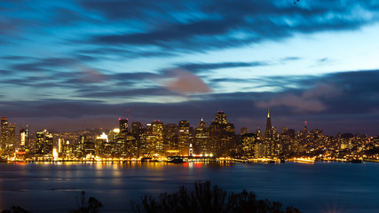 Naklejka na ściany i meble San Francisco Bay Bridge and skyline at night