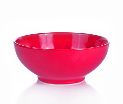 Empty red ceramic bowl isolated white background