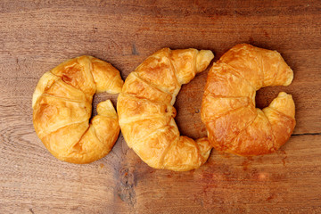 croissant bakery on teakwood table