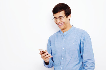 Guy texting on mobile phone