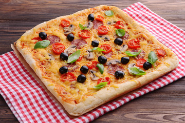 Delicious homemade pizza on table close-up