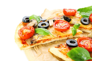 Tasty pizza with vegetables and basil on cutting board close up