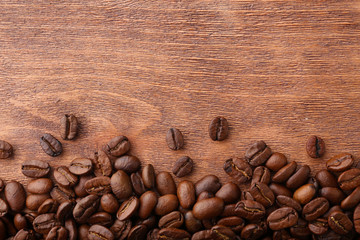 Coffee beans on wooden background