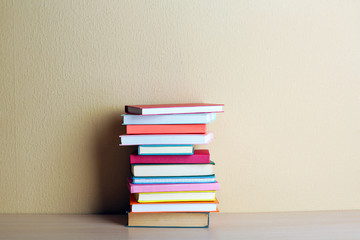 Stack of books on shelf.