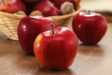 Close up of red apples on wooden background