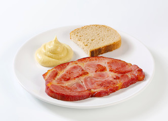 Smoked pork neck with bread and mustard