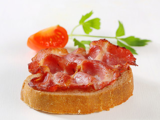 Crispy slice of pork meat on bread