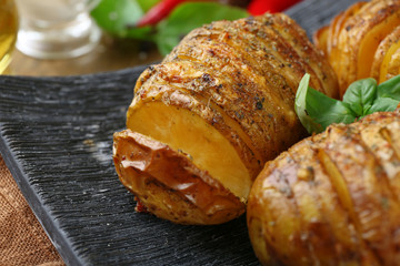 Baked potatoes in plate, closeup