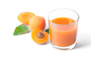 Glass of apricot juice isolated on white