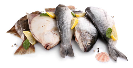 Fresh fishes with spices isolated on white