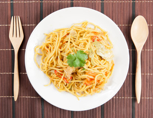 noodles and vegetables on wood
