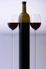 Stretched wine bottle and glasses