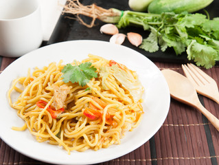 noodles and vegetables on wood