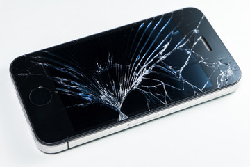 Broken screen mobile smartphone isolated on white background.