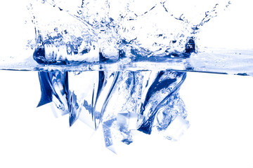 Ice cubes splashing into the water.