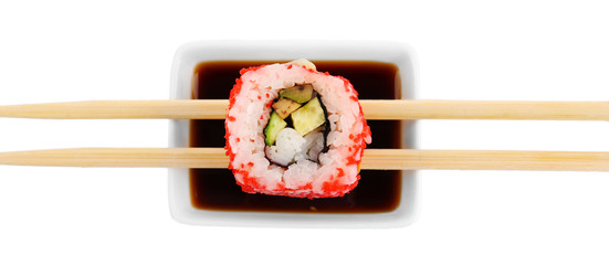 Roll with sauce and wooden sticks isolated on white