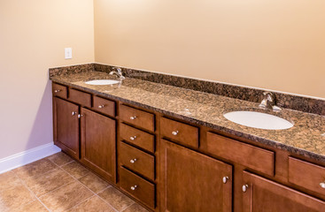 Bathroom Cabinets with Granite Vanity and Tile Floor