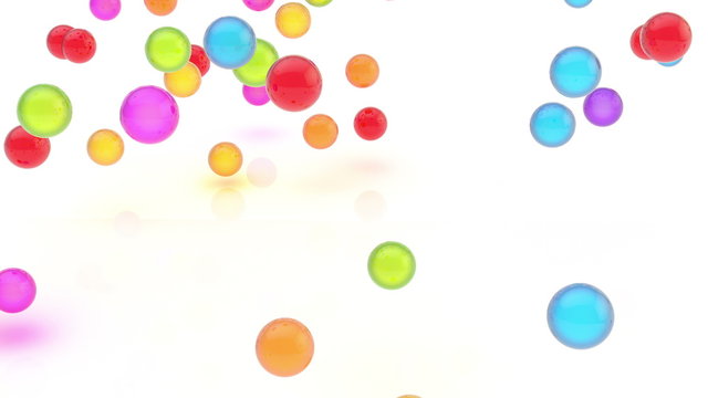 Video animation of glossy colorful falling orbs