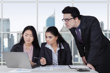 Three entrepreneurs planning a job in office